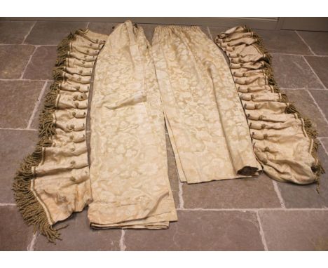 An ivory coloured floral jacquard fabric interlined curtain with plain white backing, drop 230cm, approximately 110cm wide at