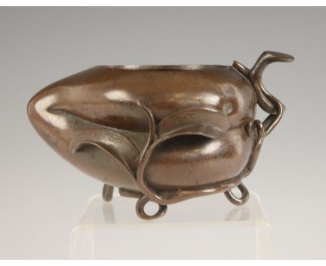 A Chinese bronze 'Gourd' censer, 19th century, modelled as a gourd with trailing foliage, raised on three entwined supports, 