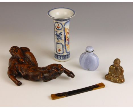 A selection of Chinese works of art, comprising; a Qianlong porcelain sleeve vase, 14cm high, a root wood carving of a sage, 