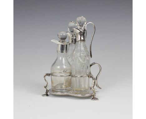 A Victorian silver cruet stand, Henry Wilkinson and Co, Sheffield 1843, the stylised shamrock shaped stand with thumbpiece de