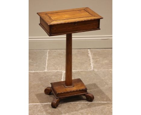 A mid 19th century ash teapoy, the hinged rectangular caddy upon a tapering octagonal column extending to a plinth base and c