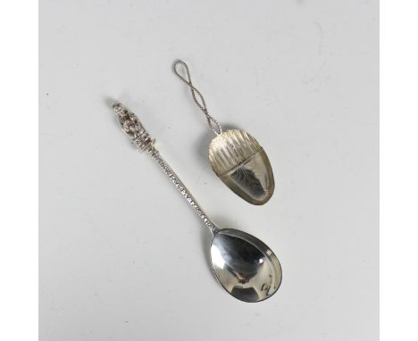 A George III silver caddy spoon, possibly John Tuner, Birmingham 1800, the acorn shaped bowl with engraved detail, with twist
