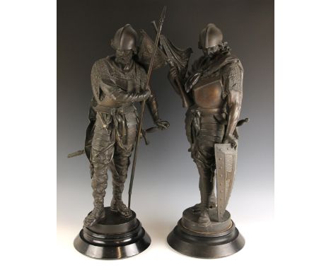 Two continental bronze patinated spelter figures of large proportions, 19th century, each modelled as a knight, one holding a