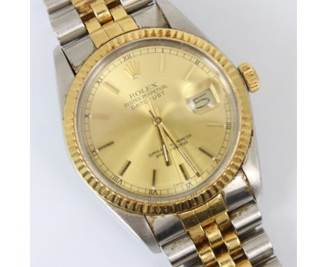 A gentleman's Rolex Oyster Perpetual Datejust wristwatch, model 16013, the champagne coloured dial with baton markers and dat