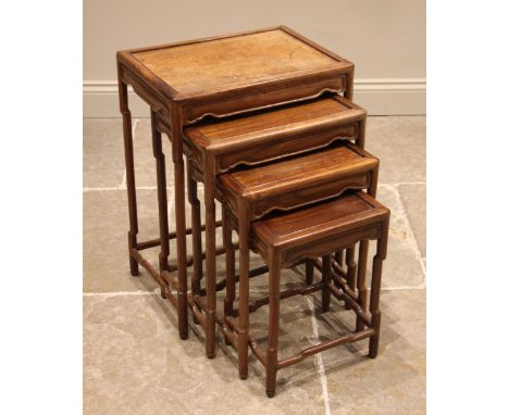 A quartetto nest of Chinese hardwood tables, 20th century, each with a framed rectangular top upon simulated bamboo legs, uni