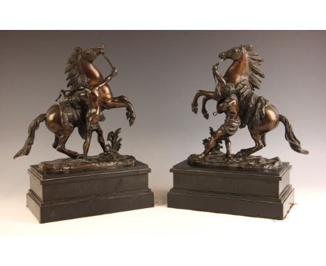 After Guillaume Coustou The Elder (French, 1677-1746), a pair of bronze patinated spelter Marly horses, 19th century, each mo