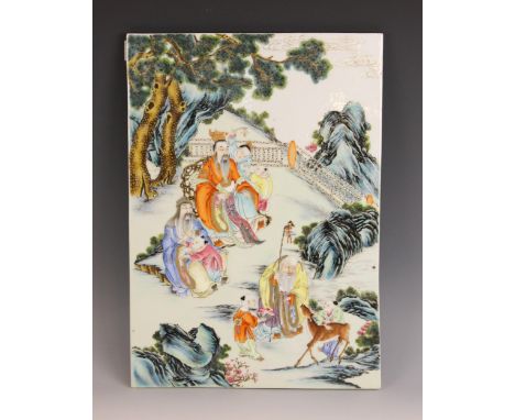 A Chinese porcelain famille verte panel or wall plaque, the rectangular panel painted to depict a seated figure with children