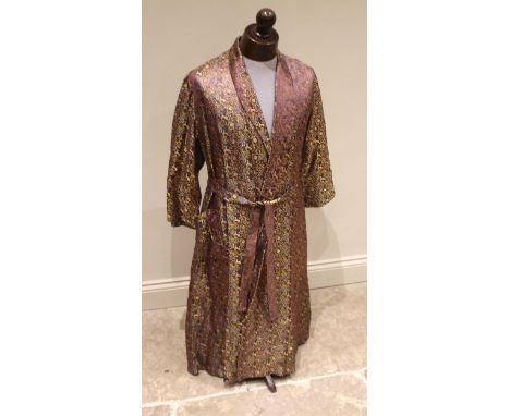 A Syrian brocade smoker's robe, mid 20th century, made for the vendor in Damascus, the fabric embellished with birds and anim