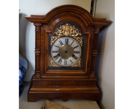 An Edwardian mahogany bracket clock complete with pendulum and key.