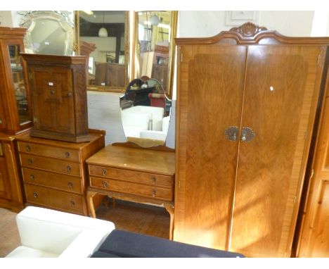 A good quality mid Century walnut three piece bedroom suite comprising twin door wardrobe, mirror back dressing table and che