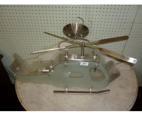 A Novel contemporary hanging ceiling lamp modelled in the form of a helicopter with chrome mount.