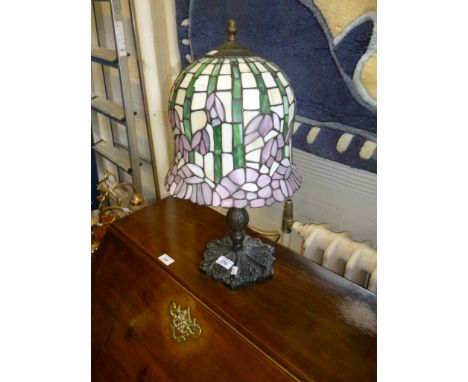 A modern Tiffany style table lamp, with stained glass shade and metal supports (sold electrically untested).