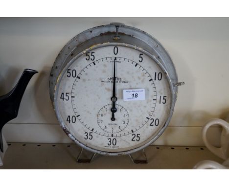 A vintage Smiths English Clock Systems, wall mounted stopwatch.