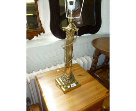 A brass corinthian column table lamp (sold electrically untested).