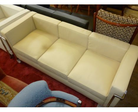 A modern Le Corbusier three seater cream sofa with chrome frame.