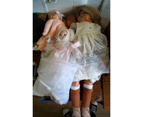 A collection of assorted vintage dolls to include celluloid example, bisque headed example, etc.