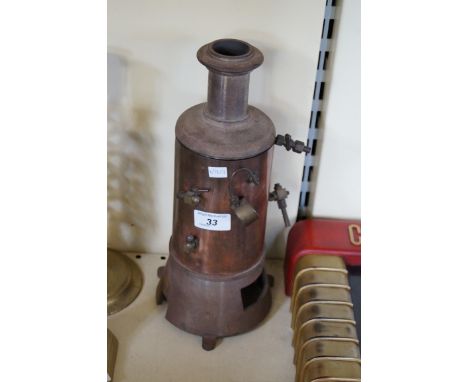 A vintage copper steam engine.