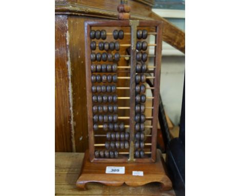 A Vintage Chinese abacus converted to a table lamp.