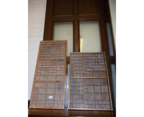 Two vintage printing block trays.