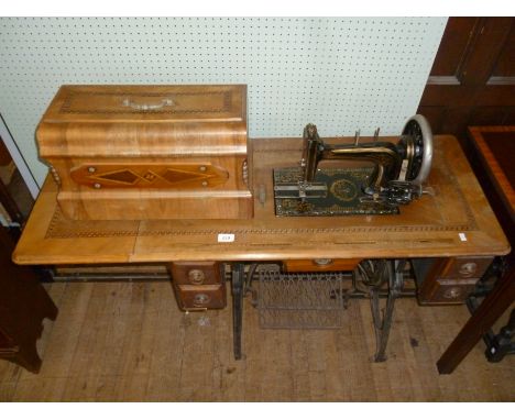 A vintage treddle sewing machine.