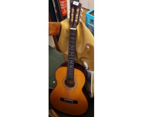 A vintage acoustic guitar with carrying bag.