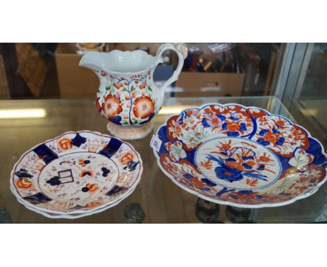 A pair of Gaudy Welsh ceramic plates together with a large jug modelled with a mask finial on the handle, together with a Jap