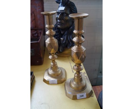 A pair of vintage brass push up candlesticks 'The King of Diamonds'.