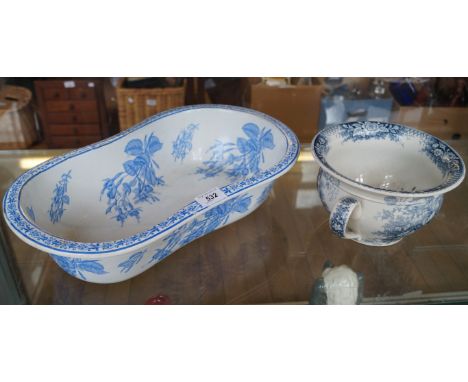 A blue and white ceramic Bidet lining decorated with floral patterns together with a further ceramic bed pan (2)