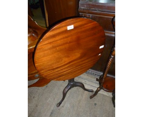 A Victorian mahogany tripod table.