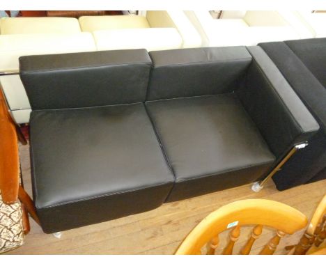 A modern Le Corbusier two seater sofa with chrome frame.