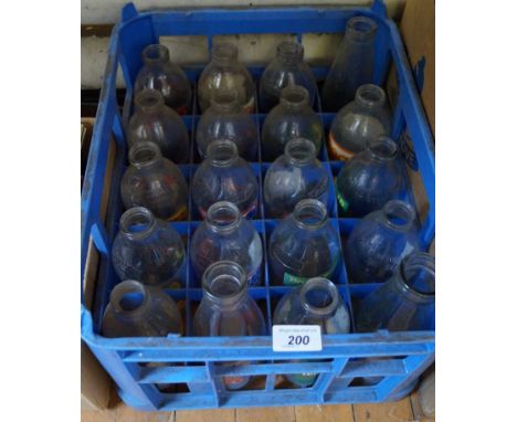 Twenty assorted vintage milk bottles.