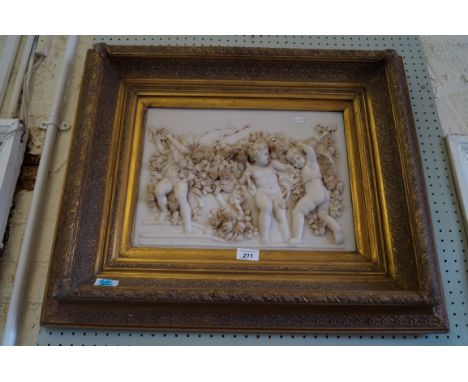 A reproduction gilt framed marble effect wall plaque depicting three cherubs playing with flowers.
