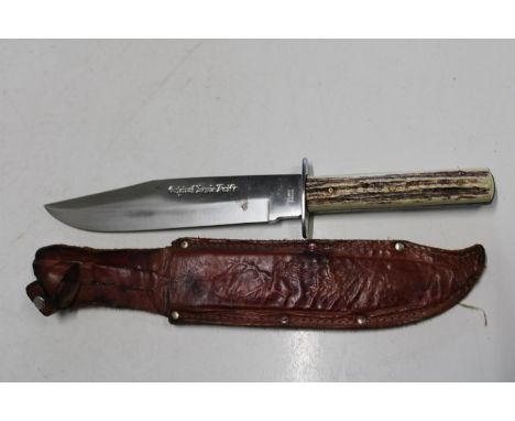 A Bowie style knife with scabbard 