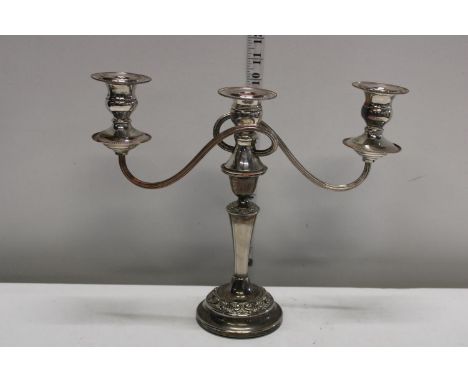 A silver plated candlestick 