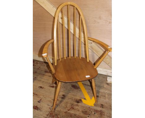 A vintage Ercol spindle back chair in light wood 