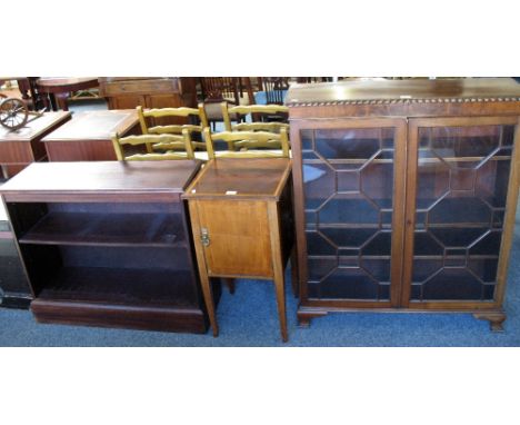 A reproduction Georgian style mahogany two-door display cabinet with astragal glazed doors and ogee bracket feet, bears label