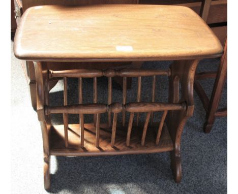 An Ercol Golden Dawn elm combined coffee able and magazine rack, 55cm wide
