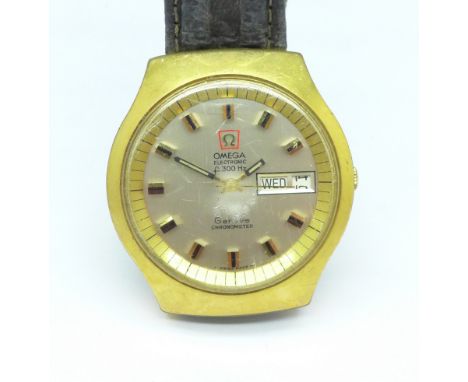 A gentleman's Omega Electronic f300Hz chronometer day date wristwatch