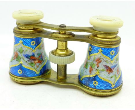 A pair of opera glasses decorated with enamel decoration, enamel cracked