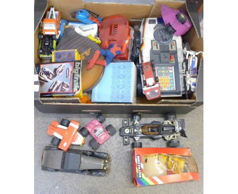 Tonka model vehicles, an MB Electronics Bigtrak with manual, The Sun football cards and other vehicles and toys