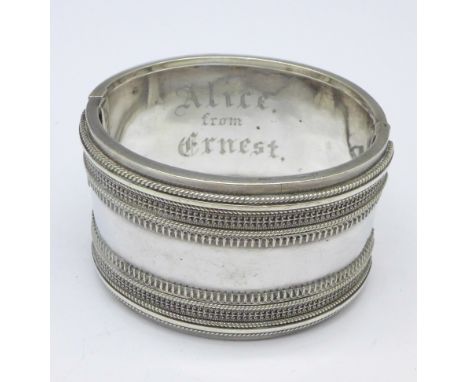 A Victorian bangle, tests as silver, 51.6g, inner bangle bears inscription