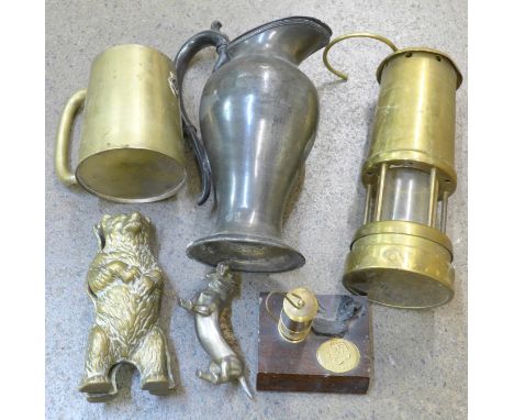 A miner's lamp, a brass bear money box, a pewter jug, etc.