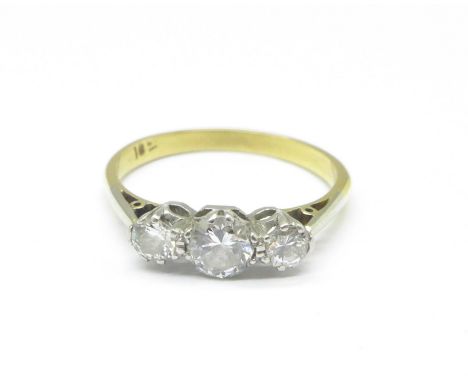 An 18ct gold, three stone diamond ring, 2.7g, N