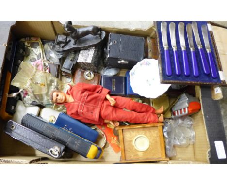 A box of assorted items, model rail, Steve Austen action figure, etc.
