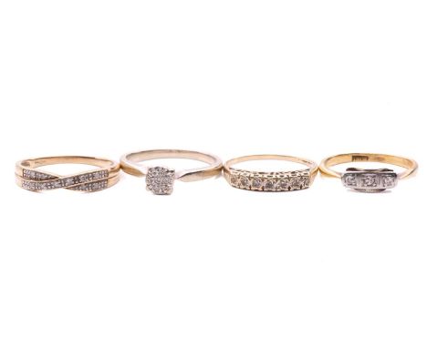 Four diamond rings; a three stone ring with a total estimated diamond weight of 0.06ct, marked 18ct, ring size K, a cluster r