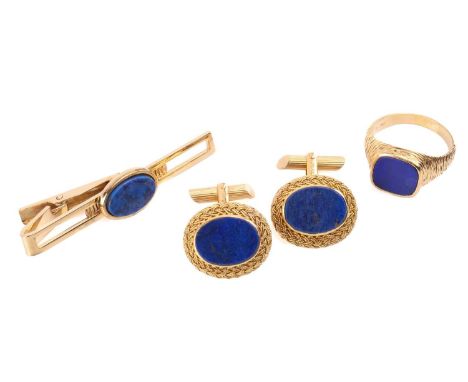 A pair of lapis lazuli cufflinks with filigree surround, marked 'Italy 18k', a lapis lazuli signet ring in textured metal mar