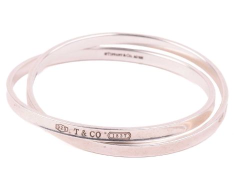 Tiffany &amp; Co. - an '1837' interlocking circles bracelet, consisting of two interlocking concave-shaped bands, signed and 