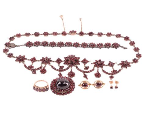 A Victorian Bohemian garnet necklace, set with clusters and swags of garnets, with a length of 47cm, together with a Bohemian