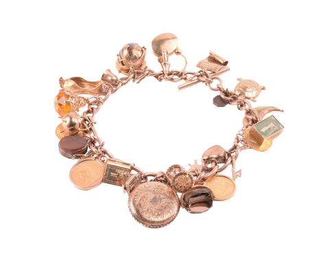 A double Albert chain charm bracelet in 9ct rose gold, constituted of a heavy curb link terminated with swivel clasps at the 