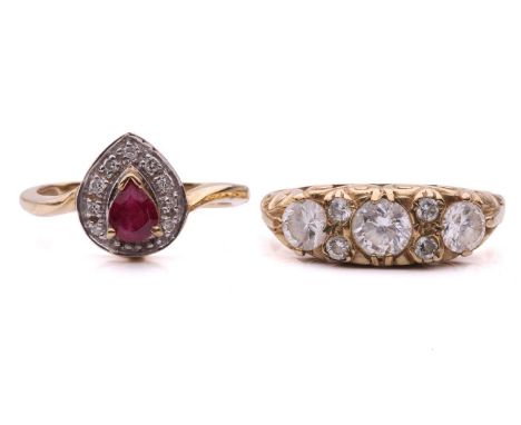 Two gem-set dress rings; the ruby and diamond cluster ring, set with a pear shape ruby surrounded by round brilliant and sing